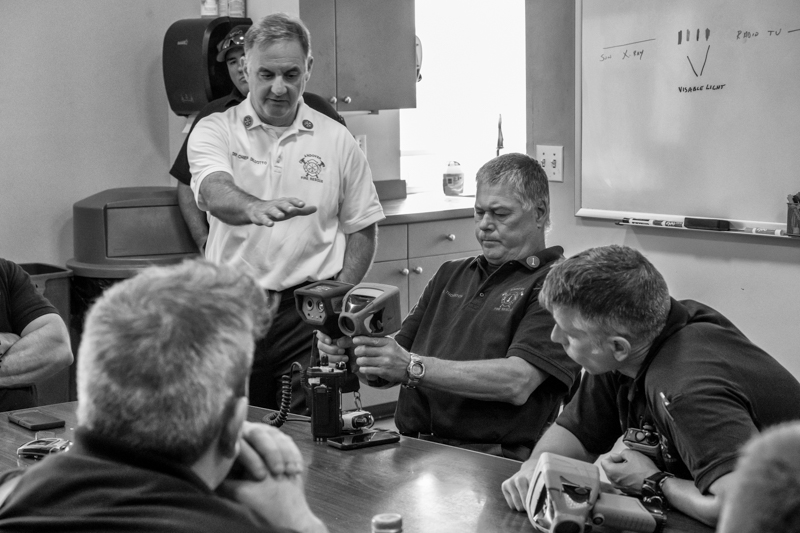 Town workers talking around a table.